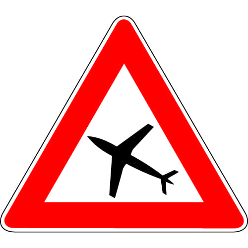 Sinjali në figurë paralajmëron një zonë, ku fluturojnë avionë në lartësi të madhe.